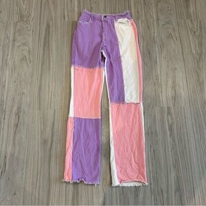 Shein pastel purple, pink, and white patchwork straight leg jeans.